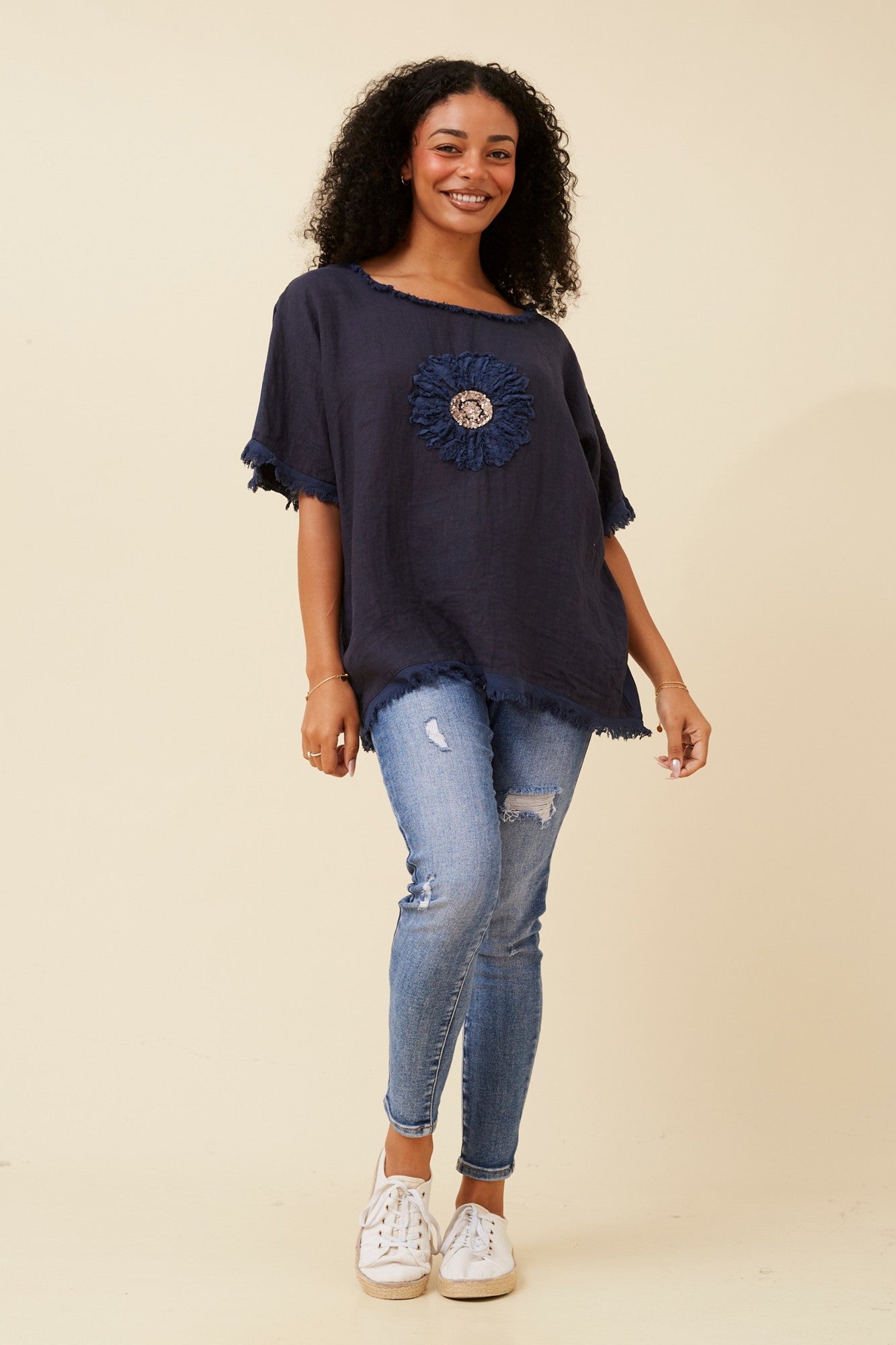 Image of a model wearing Tops. Product name - SUNFLOWER PATCHWORK LINEN TOP in Navy colour by brand - BOTTEGA MODA
