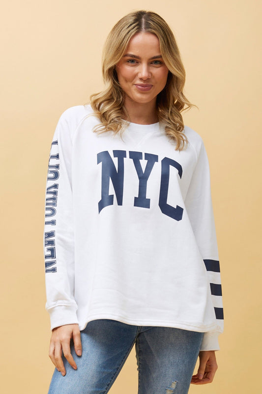 Image of a model wearing Tops. Product name - HUETTE GRAPHIC PRINT TOP in White colour by brand - Caroline Morgan Australia