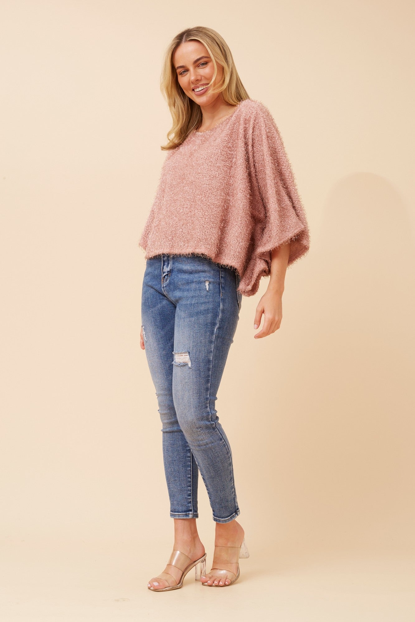 Image of a model wearing Tops. Product name - RUSHANA EYELASH YARN TOP in Blush colour by brand - BOTTEGA MODA