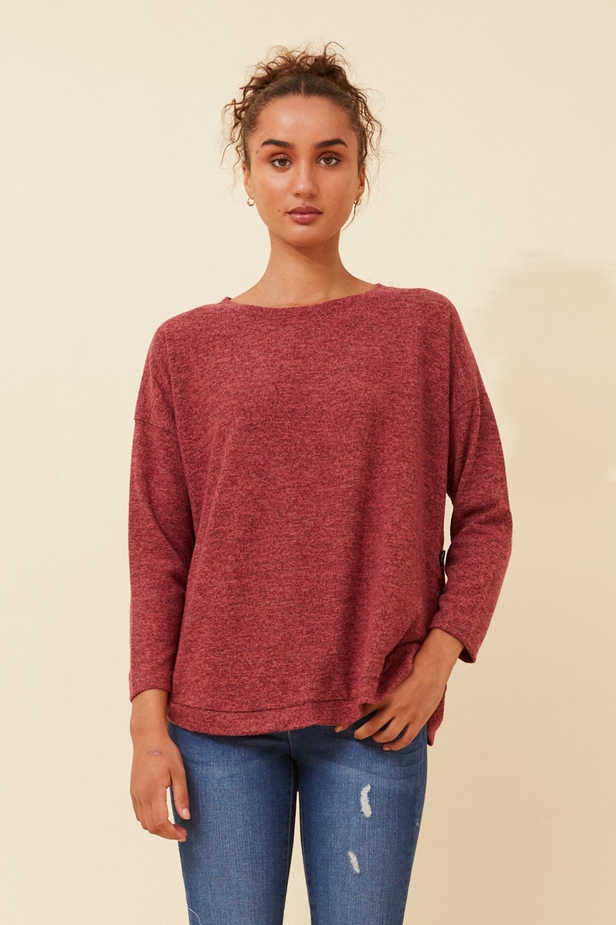 Image of a model wearing Tops. Product name - EVAN BUTTON DETAIL TOP in Red colour by brand - Caroline Morgan Australia