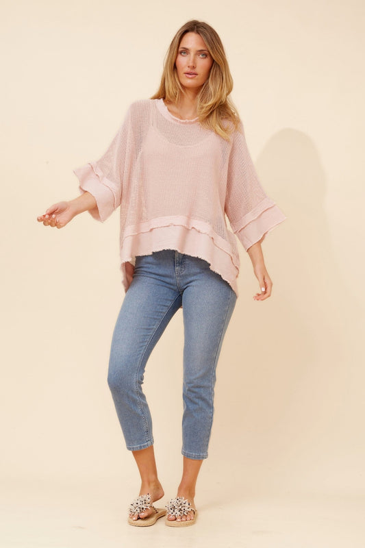 Image of a model wearing Tops. Product name - ROSAMUND RAW EDGE TOP in White colour by brand - BOTTEGA MODA