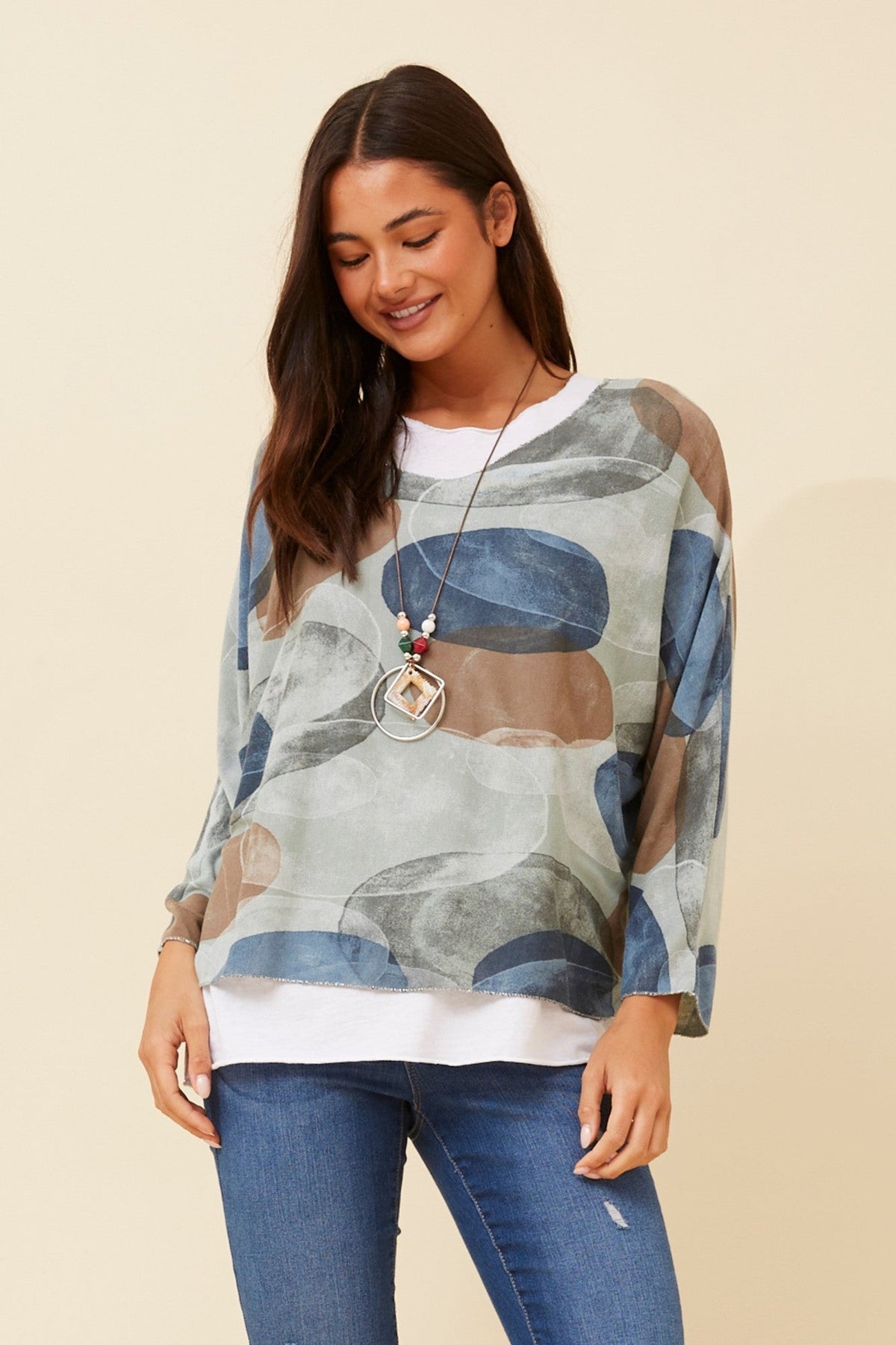 Image of a model wearing Tops. Product name - MELIKA ABSTRACT PRINT TOP in Sage colour by brand - BOTTEGA MODA