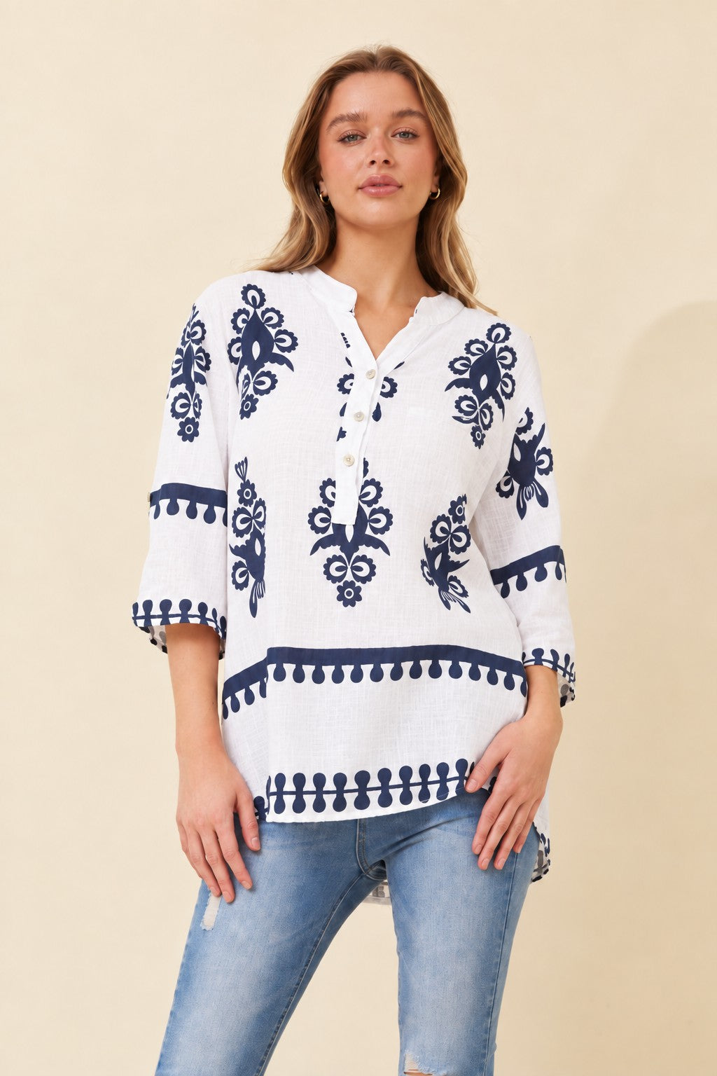 Image of a model wearing Tops. Product name - FERRERA BOHO PRINT TOP in White/Navy colour by brand - BOTTEGA MODA