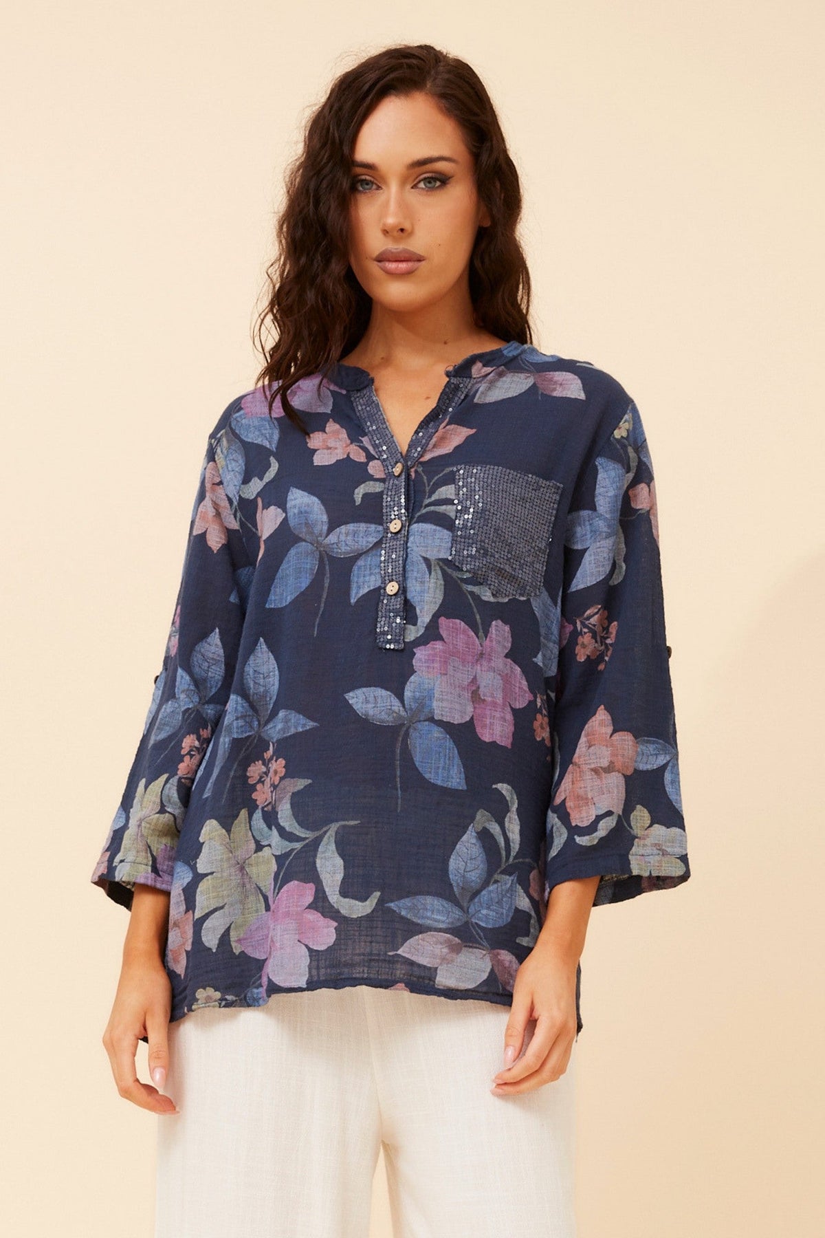 Image of a model wearing Tops. Product name - ROSETTA FLORAL TOP in Light Denim colour by brand - BOTTEGA MODA