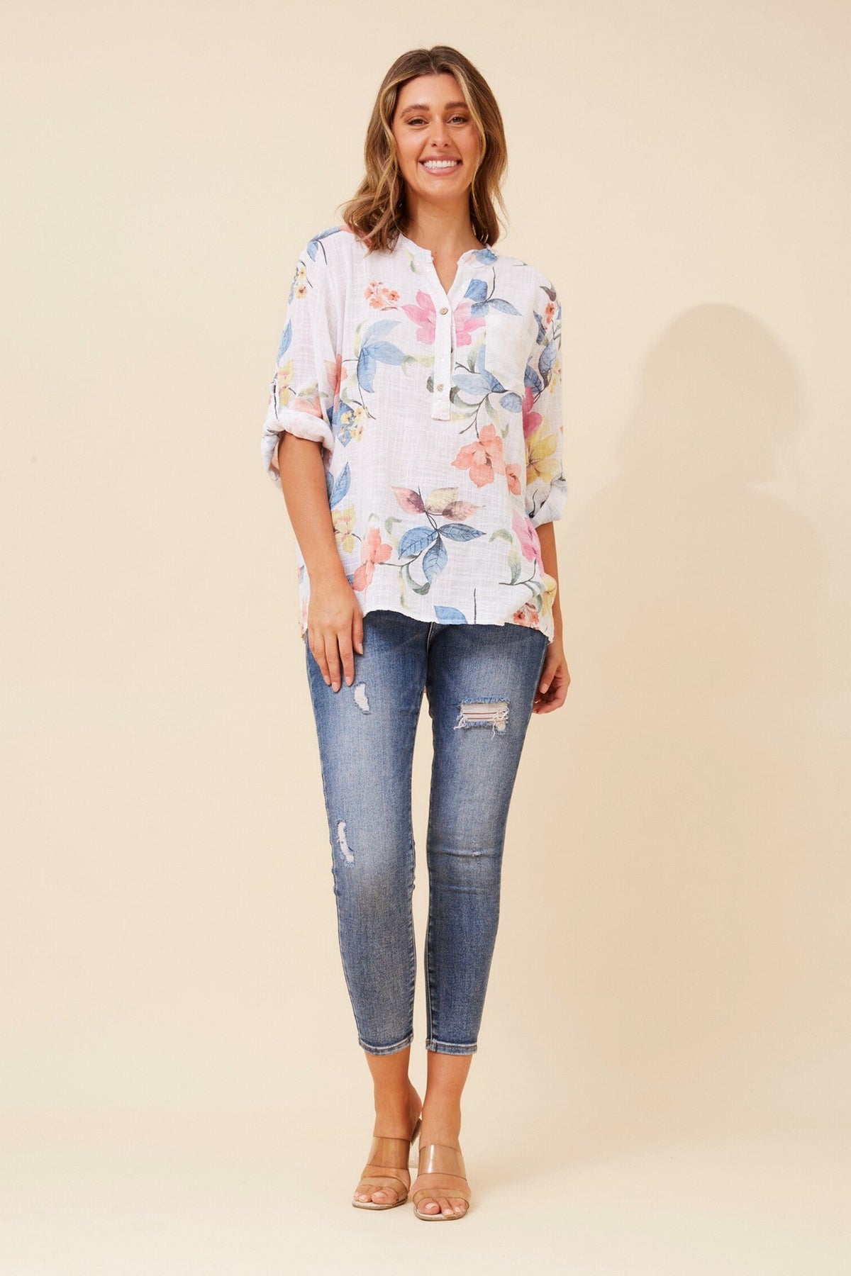 Image of a model wearing Tops. Product name - ROSETTA FLORAL TOP in Light Denim colour by brand - BOTTEGA MODA
