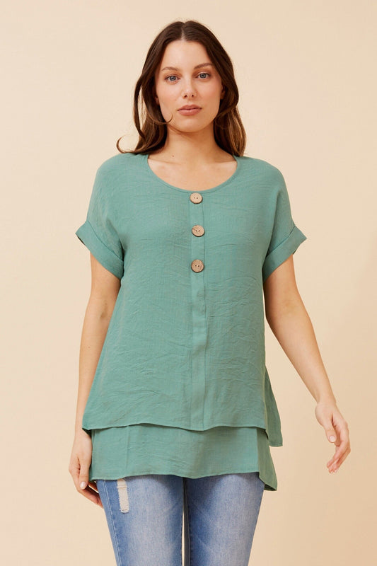 Image of a model wearing Tops. Product name - JAYCEE SOLID TOP in Green Ash colour by brand - Caroline Morgan Australia