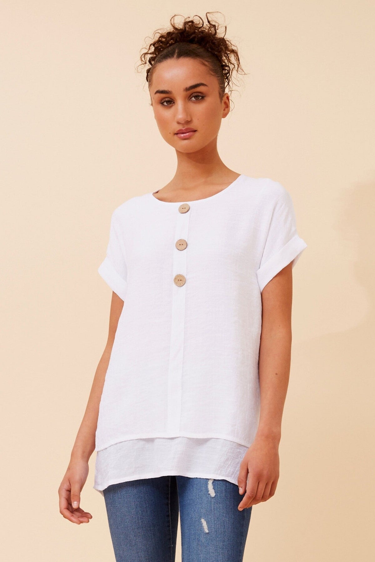 Image of a model wearing Tops. Product name - JAYCEE SOLID TOP in White colour by brand - Caroline Morgan Australia