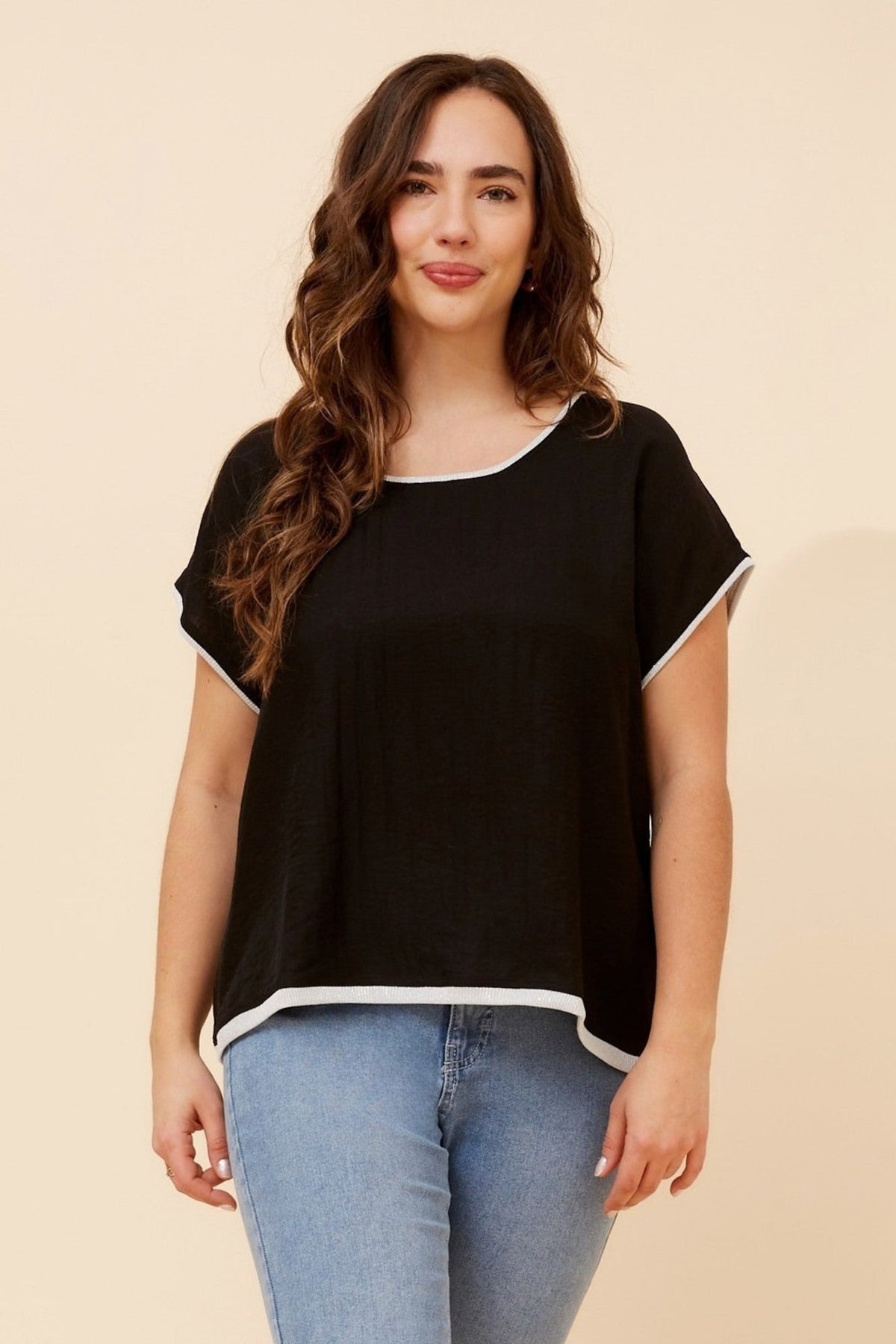 Image of a model wearing Tops. Product name - LYNKA SOLID LINEN BLEND TOP in Black colour by brand - Caroline Morgan Australia