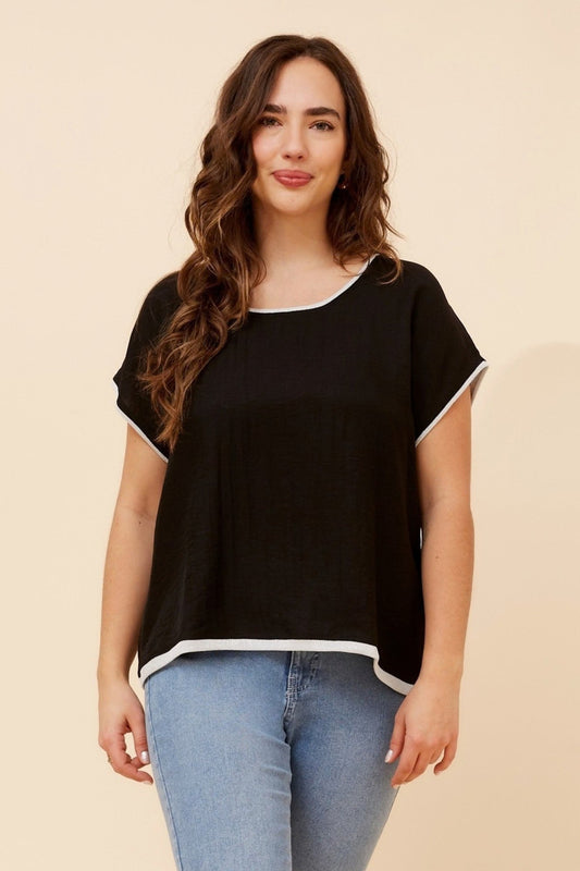 Image of a model wearing Tops. Product name - LYNKA SOLID LINEN BLEND TOP in Black colour by brand - Caroline Morgan Australia