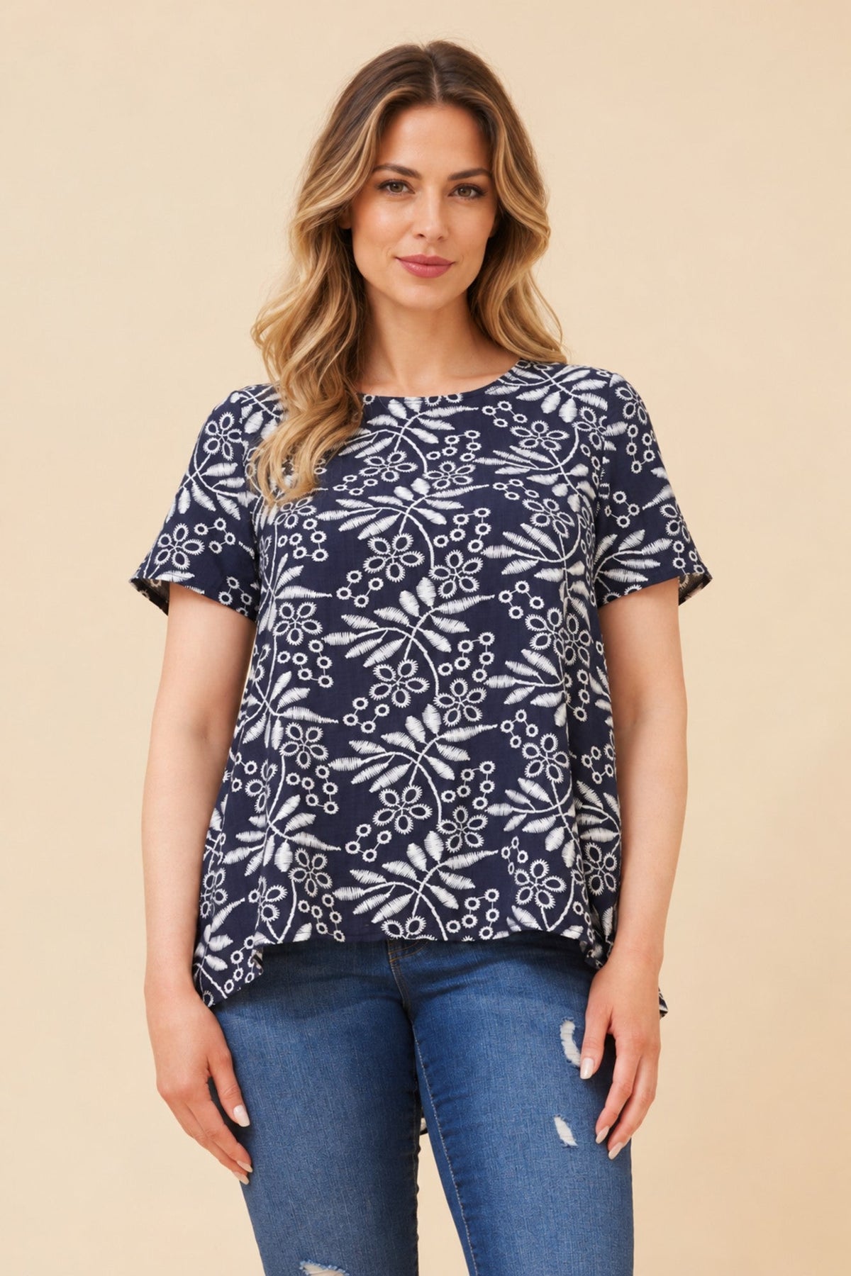 Image of a model wearing Tops. Product name - MALISSA ABSTRACT PRINT TOP in Navy colour by brand - Caroline Morgan Australia