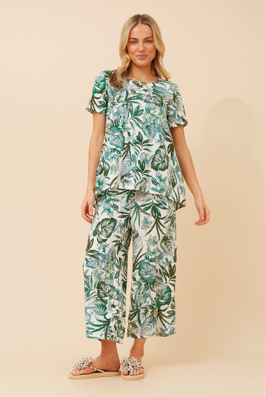 Image of a model wearing Tops. Product name - MALISSA LEAF PRINT TOP in Green colour by brand - Caroline Morgan Australia