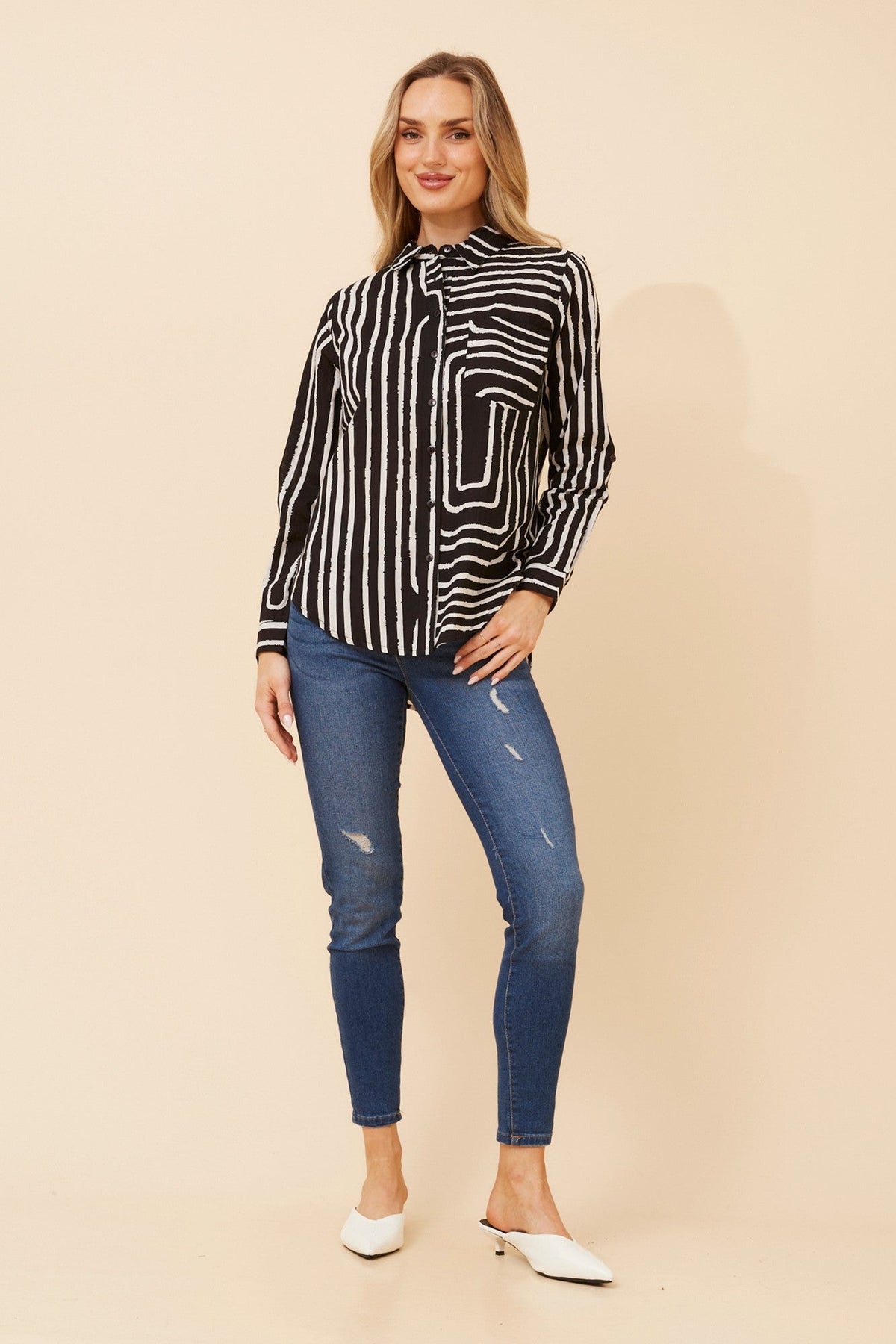 Image of a model wearing Tops. Product name - MARGARET STRIPE PRINT TOP in Black colour by brand - MYSTIC MONSOON