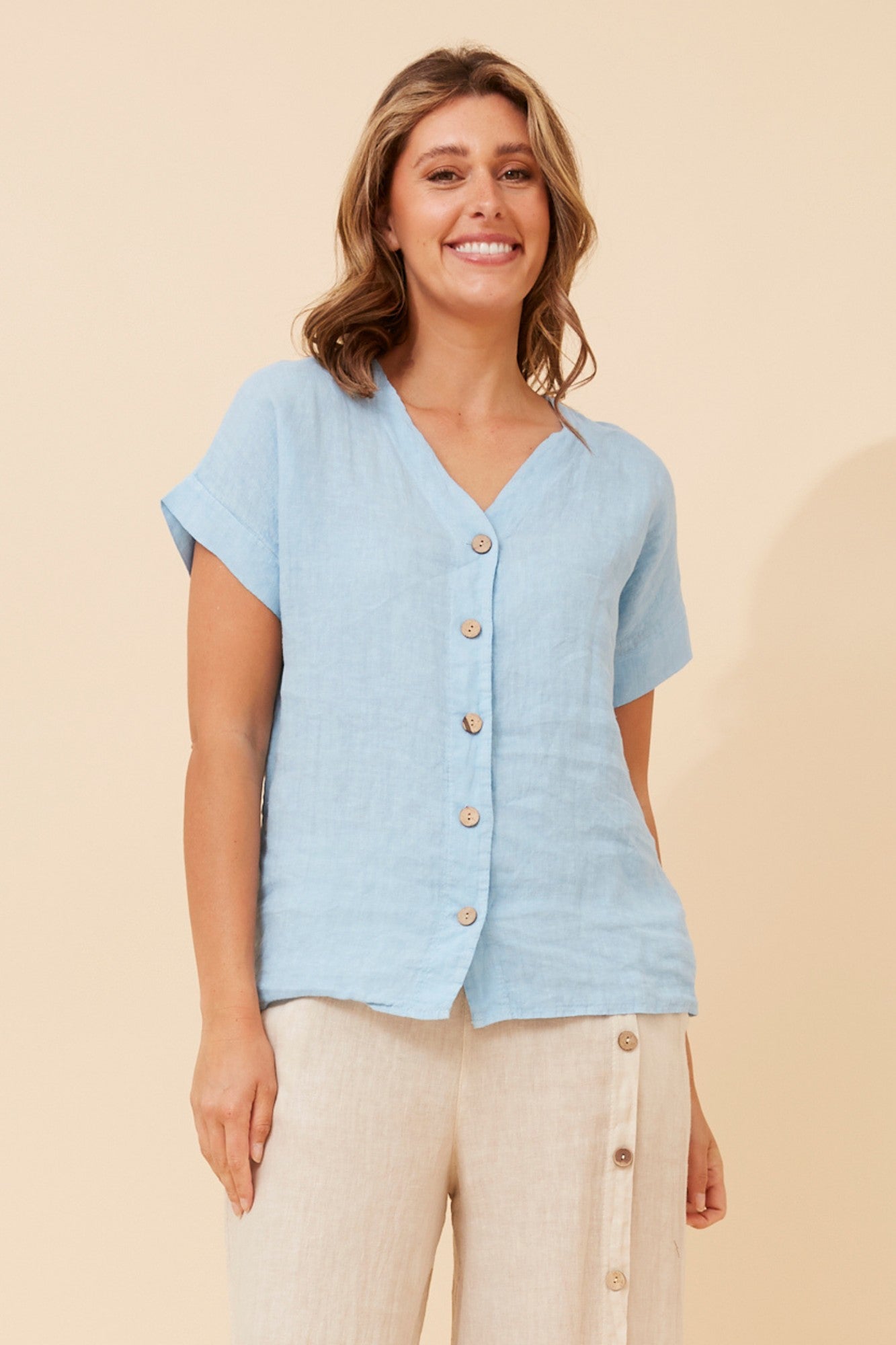 Image of a model wearing Tops. Product name - SIMONETTA SOLID TOP in Blu Scuvo colour by brand - BOTTEGA MODA