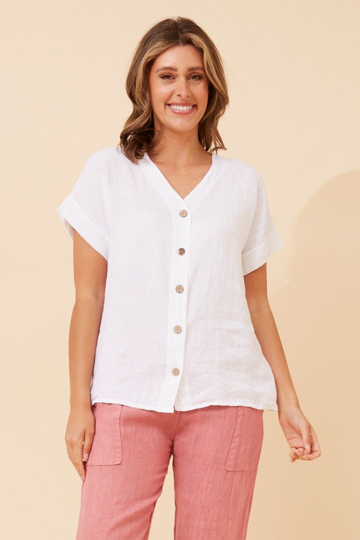Image of a model wearing Tops. Product name - SIMONETTA SOLID TOP in White colour by brand - BOTTEGA MODA