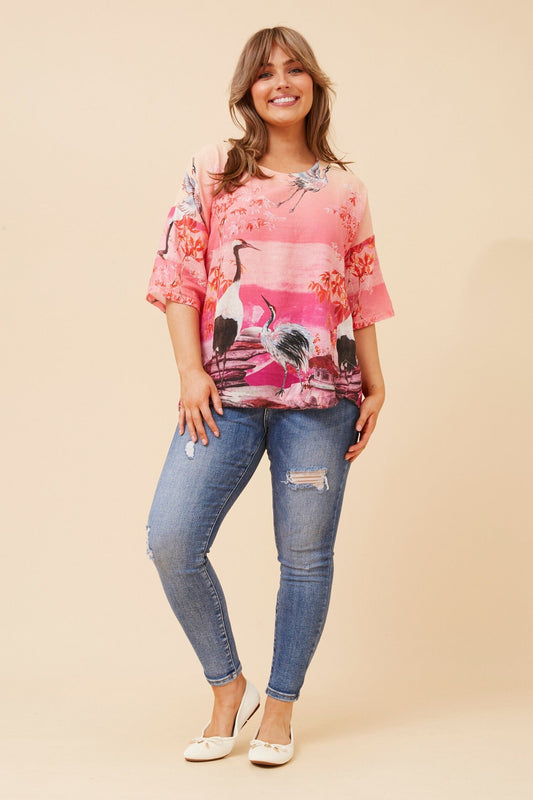 Image of a model wearing Tops. Product name - BABS BIRD PRINT LINEN TOP in Multi Pink colour by brand - BOTTEGA MODA