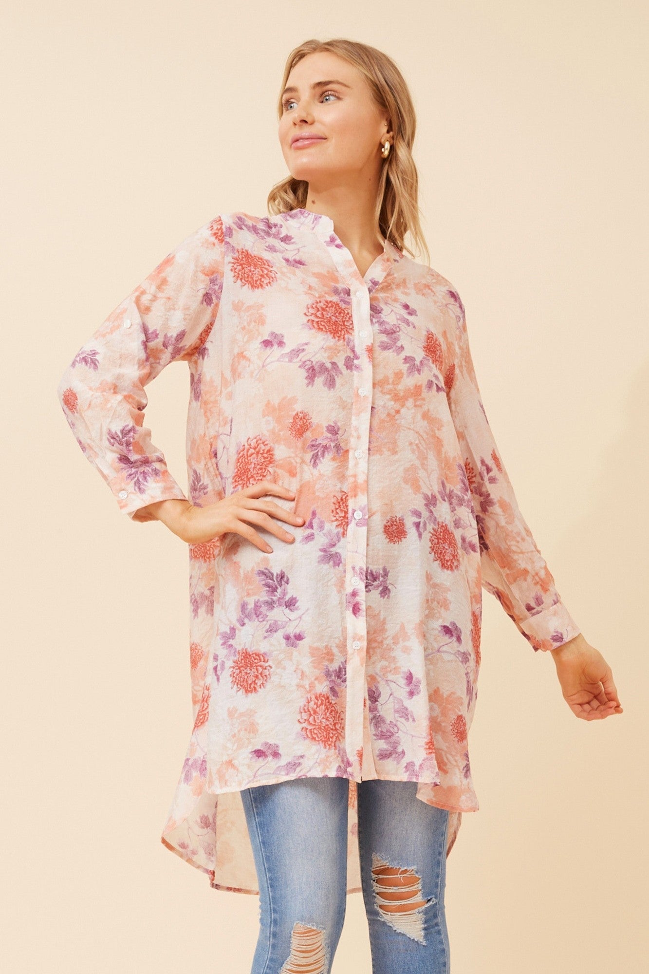 Image of a model wearing Outerwear. Product name - JANSON FLORAL TUNIC SHIRT in Pink colour by brand - Caroline Morgan Australia