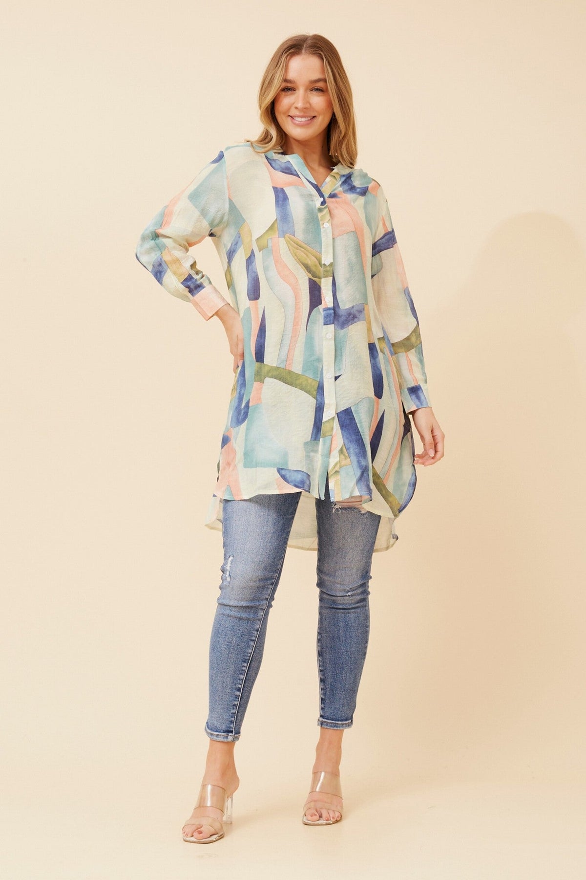Image of a model wearing Outerwear. Product name - JANSON ABSTRACT PRINT TUNIC SHIRT in Mint colour by brand - Caroline Morgan Australia