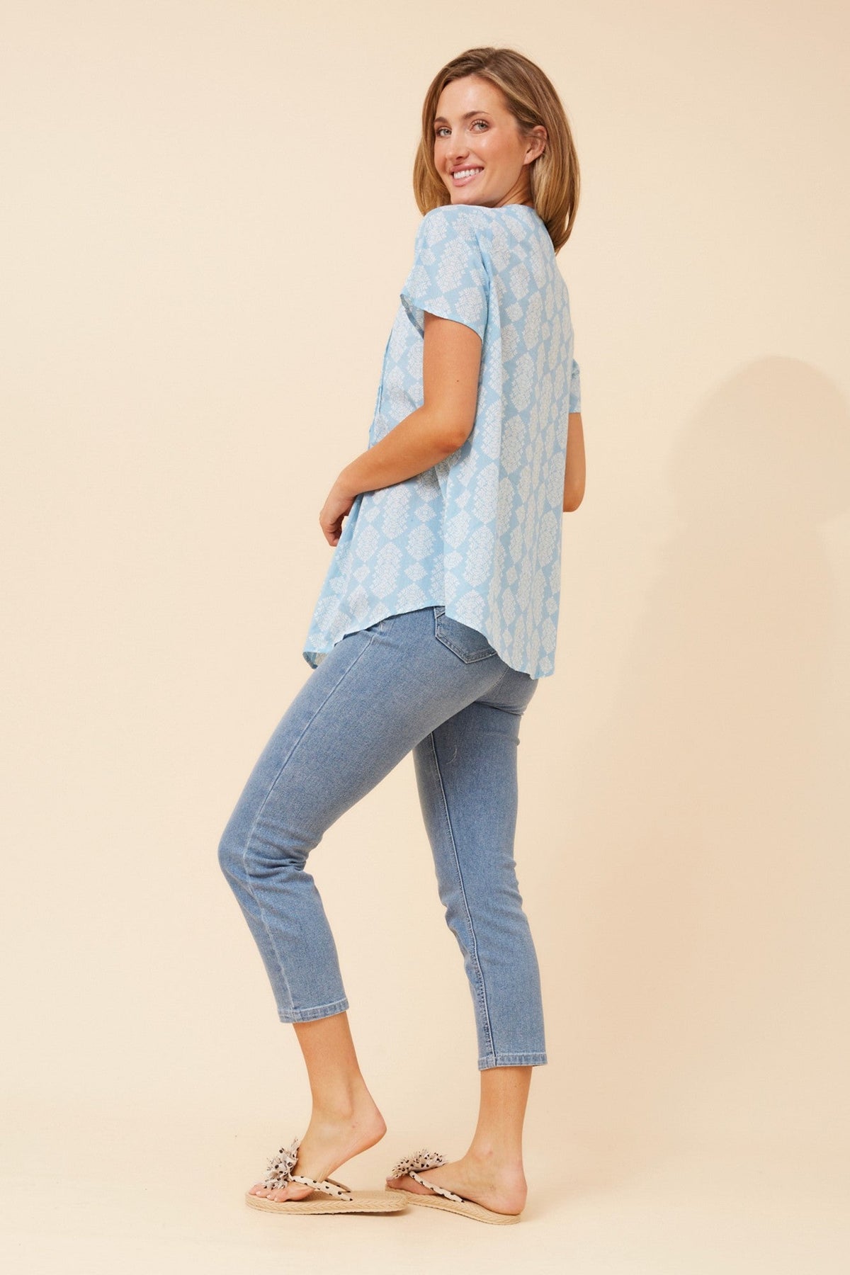 Image of a model wearing Tops. Product name - GEORGIANA PLEATED TOP in Pale Blue colour by brand - MYSTIC MONSOON