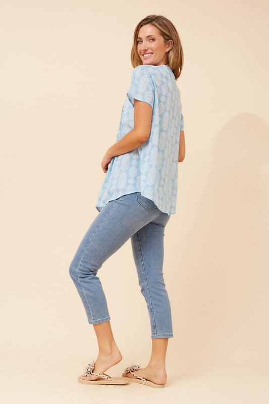 Image of a model wearing Tops. Product name - GEORGIANA PLEATED TOP in Pale Blue colour by brand - MYSTIC MONSOON