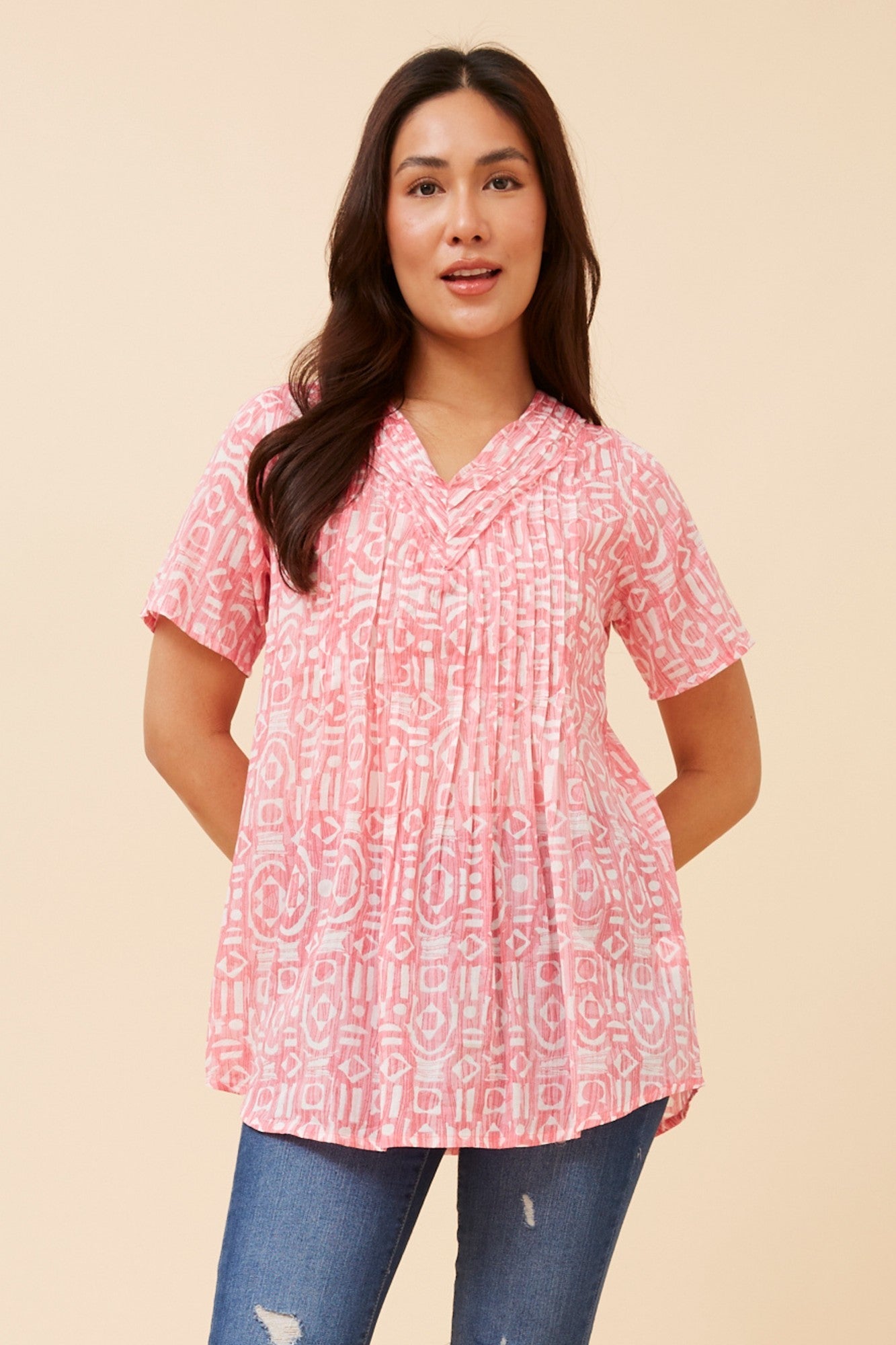 Image of a model wearing Tops. Product name - GIORGIANA ABSTRACT PRINT TOP in Pink colour by brand - MYSTIC MONSOON