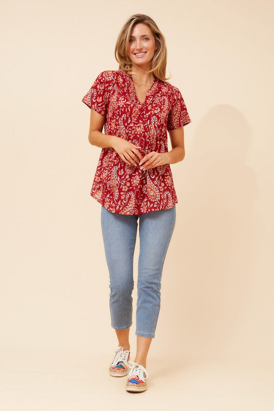Image of a model wearing Tops. Product name - GIORGIANA PAISLEY PRINT TOP in Red colour by brand - MYSTIC MONSOON