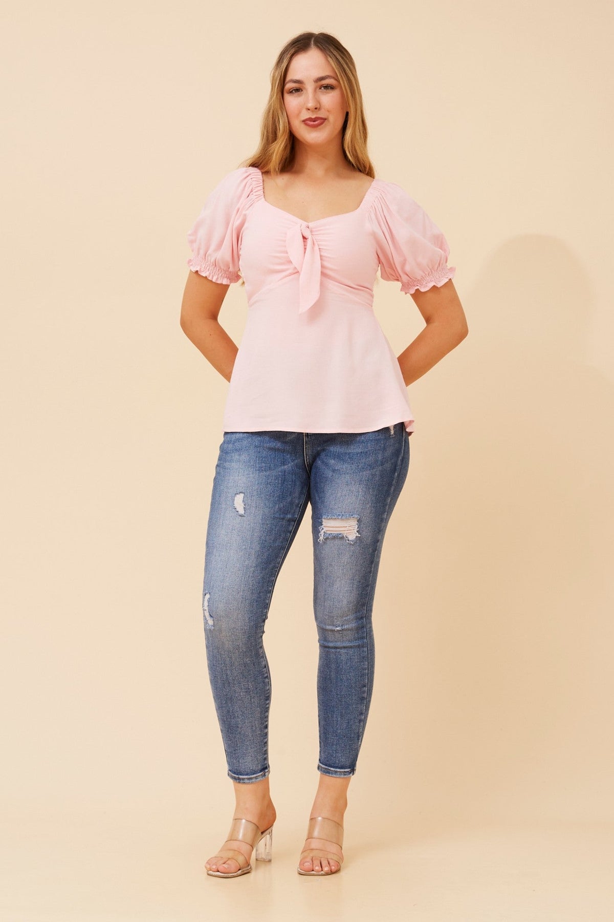 Image of a model wearing Tops. Product name - ZAIA SOLID TOP in Black colour by brand - Caroline Morgan Australia