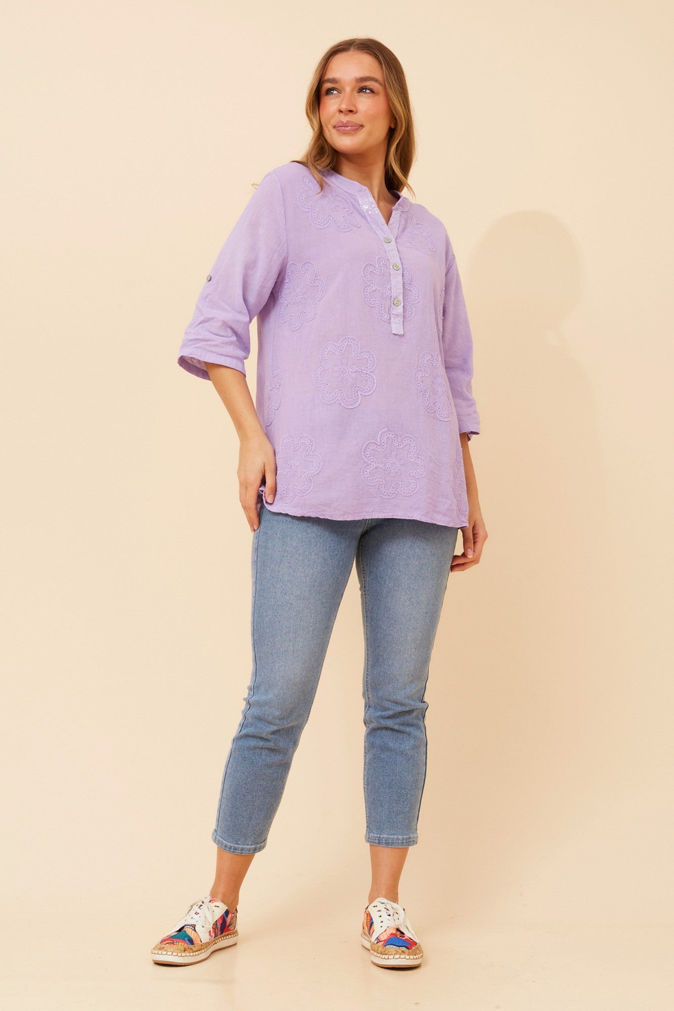 Image of a model wearing Tops. Product name - ROSETTI FLORAL EMBROIDERED TOP in White colour by brand - BOTTEGA MODA