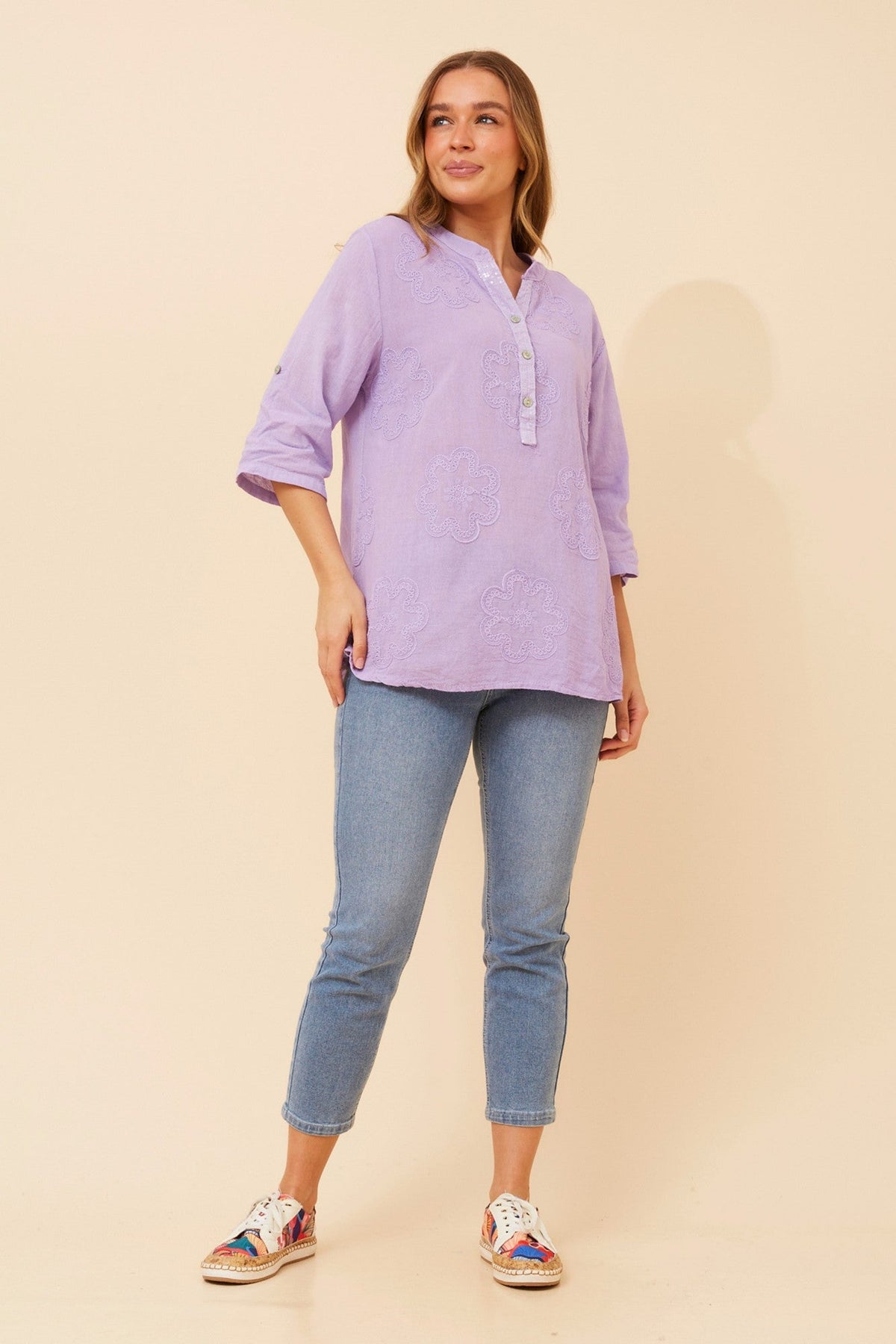 Image of a model wearing Tops. Product name - ROSETTI FLORAL EMBROIDERED TOP in White colour by brand - BOTTEGA MODA