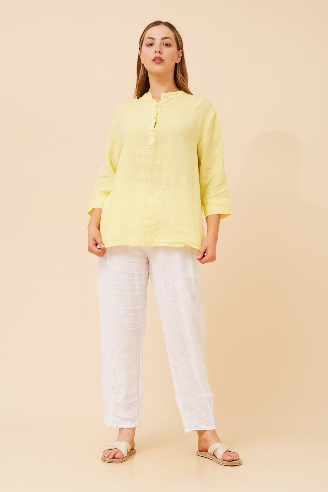Image of a model wearing Tops. Product name - EVREN LINEN TOP in Denim colour by brand - BOTTEGA MODA