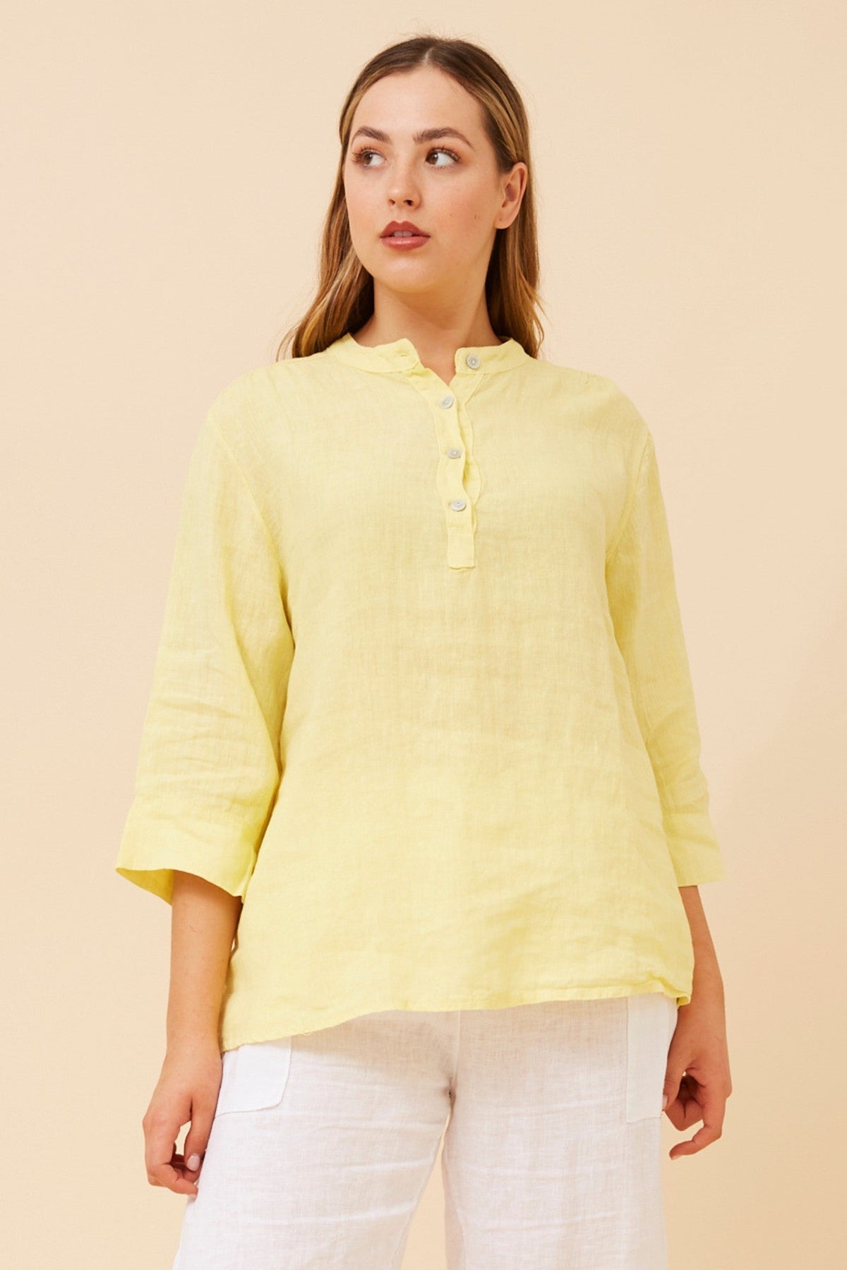 Image of a model wearing Tops. Product name - EVREN LINEN TOP in Giallo colour by brand - BOTTEGA MODA