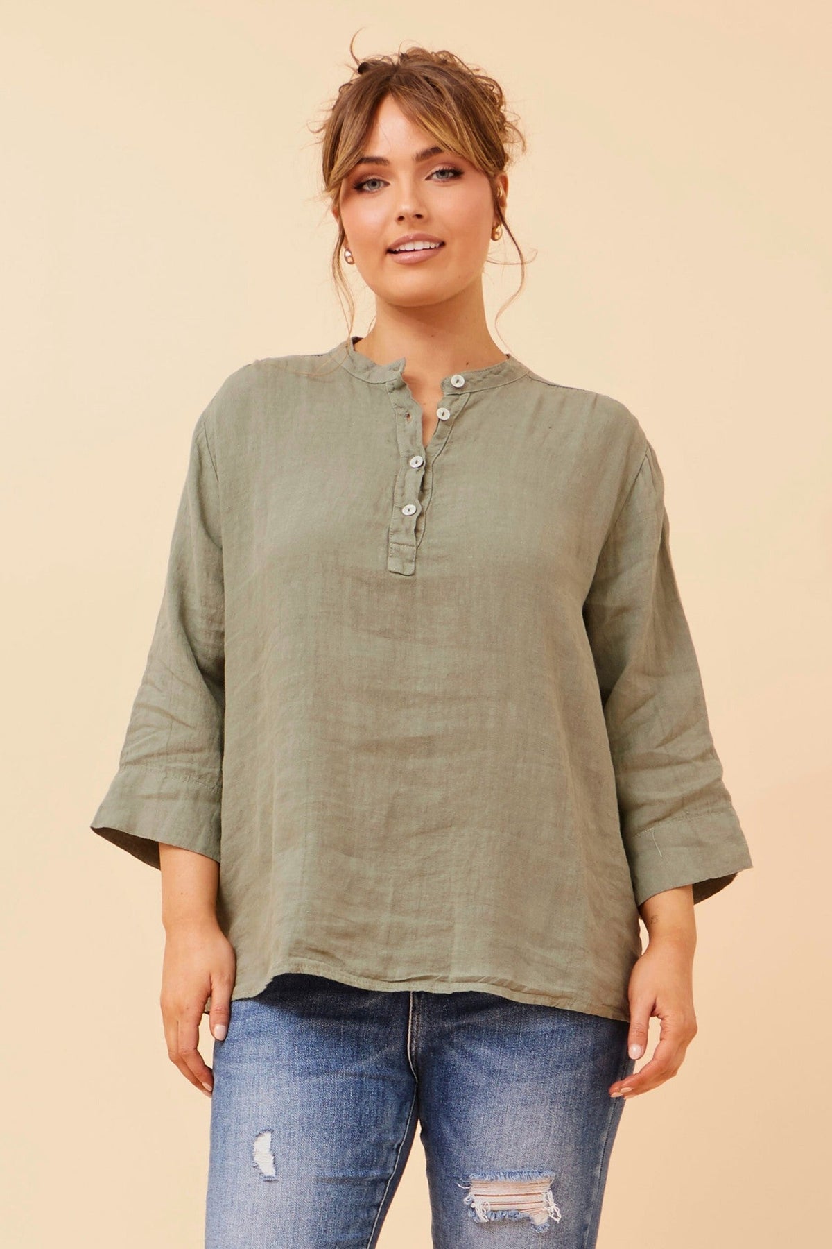 Image of a model wearing Tops. Product name - EVREN LINEN TOP in Khaki colour by brand - BOTTEGA MODA