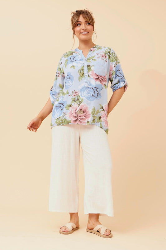 Image of a model wearing Tops. Product name - ROSETTA FLORAL PRINT TOP in Light Blue colour by brand - BOTTEGA MODA