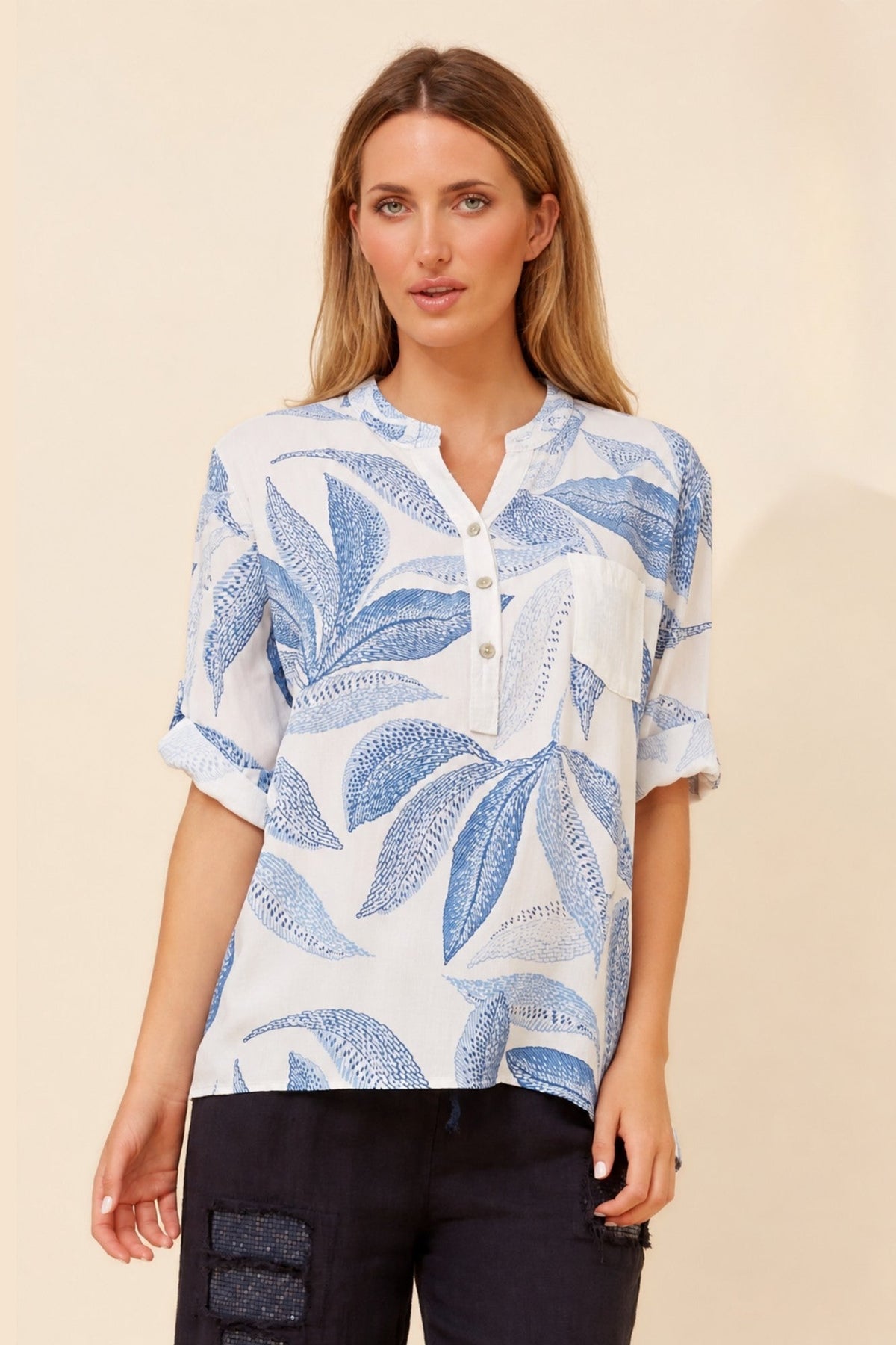 Image of a model wearing Tops. Product name - ROSETTA LEAF PRINT TOP in Ocean Blue colour by brand - BOTTEGA MODA
