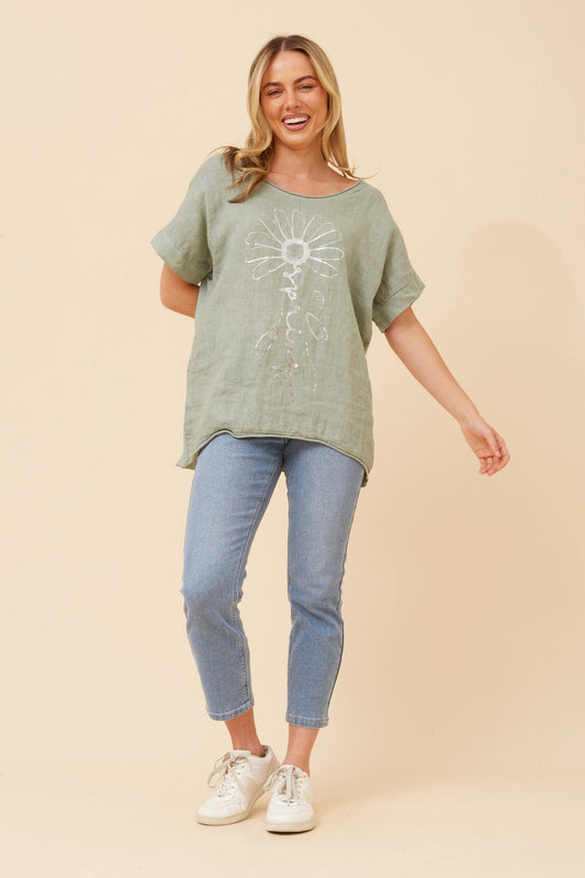 Image of a model wearing Tops. Product name - PALIMA FOIL PRINT LINEN TOP in Sage colour by brand - BOTTEGA MODA