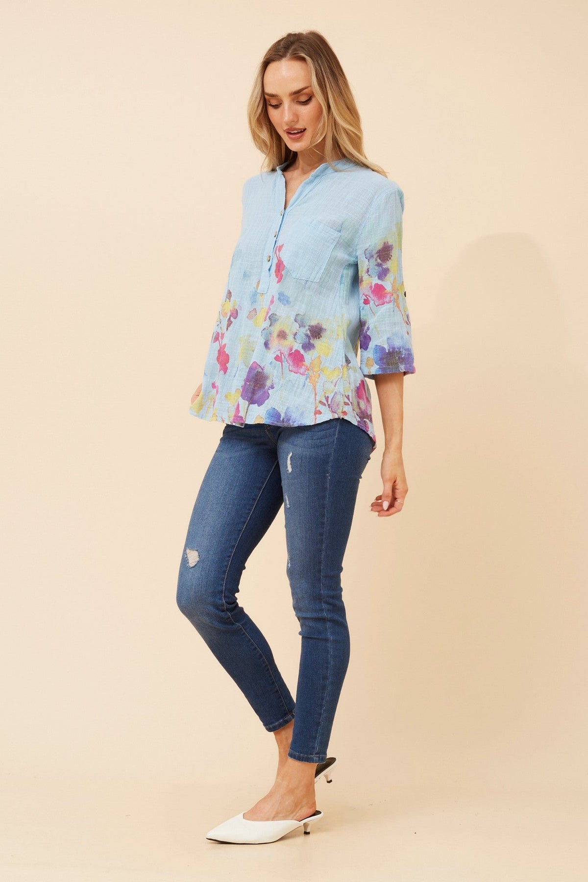 Image of a model wearing Tops. Product name - ROSETTA FLORAL TOP in White colour by brand - BOTTEGA MODA