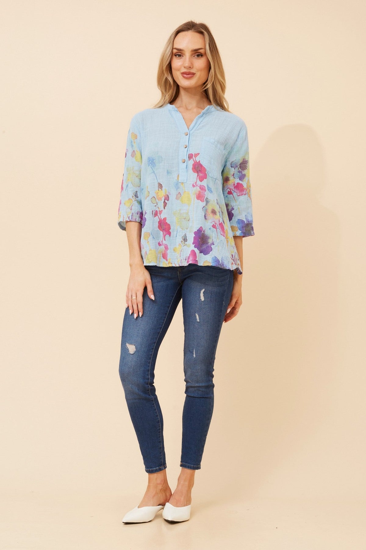 Image of a model wearing Tops. Product name - ROSETTA FLORAL TOP in Skylight colour by brand - BOTTEGA MODA