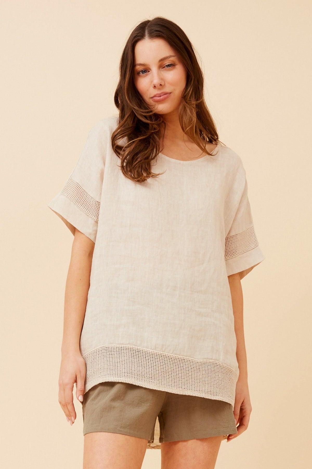 Image of a model wearing Tops. Product name - VIVALDA SOLID LINEN TOP in Linen colour by brand - BOTTEGA MODA
