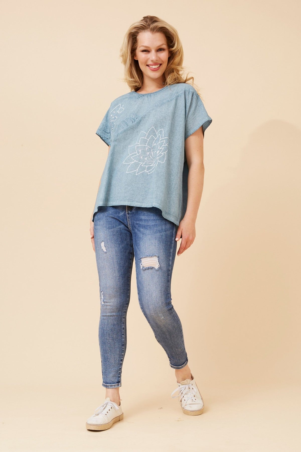 Image of a model wearing Tops. Product name - JOLANDA EMBROIDERED TOP in Latte colour by brand - Caroline Morgan Australia