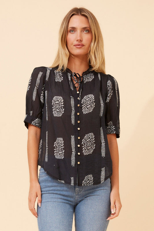 Image of a model wearing Tops. Product name - BRINLEY ABSTRACT PRINT TOP in Midnight Black colour by brand - Caroline Morgan Australia