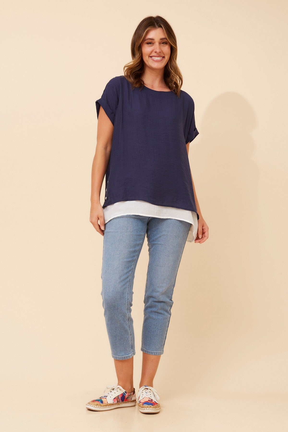 Image of a model wearing Tops. Product name - RAYMOND DOUBLE LAYERED TOP in Navy colour by brand - Caroline Morgan Australia