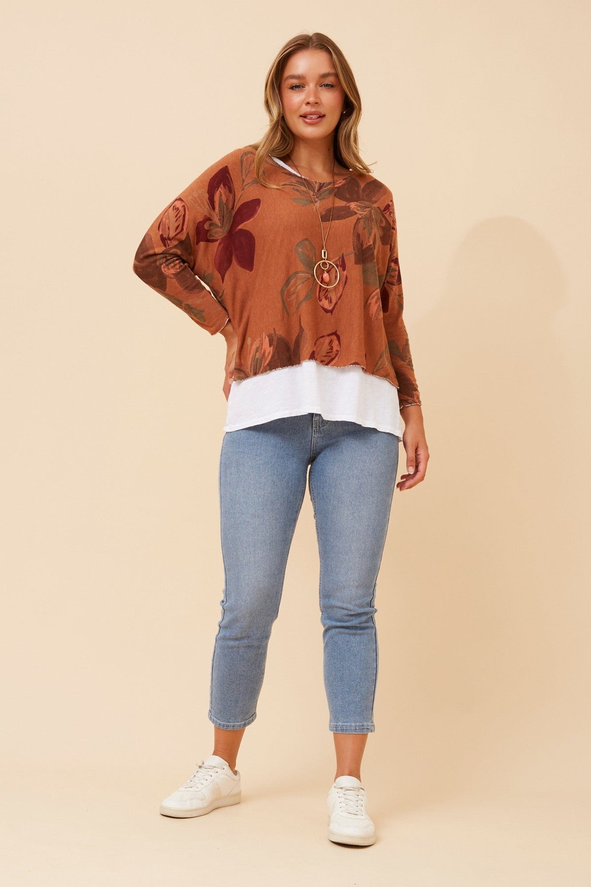 Image of a model wearing Tops. Product name - MELIKA DOUBLE LAYER TOP in Orange colour by brand - BOTTEGA MODA