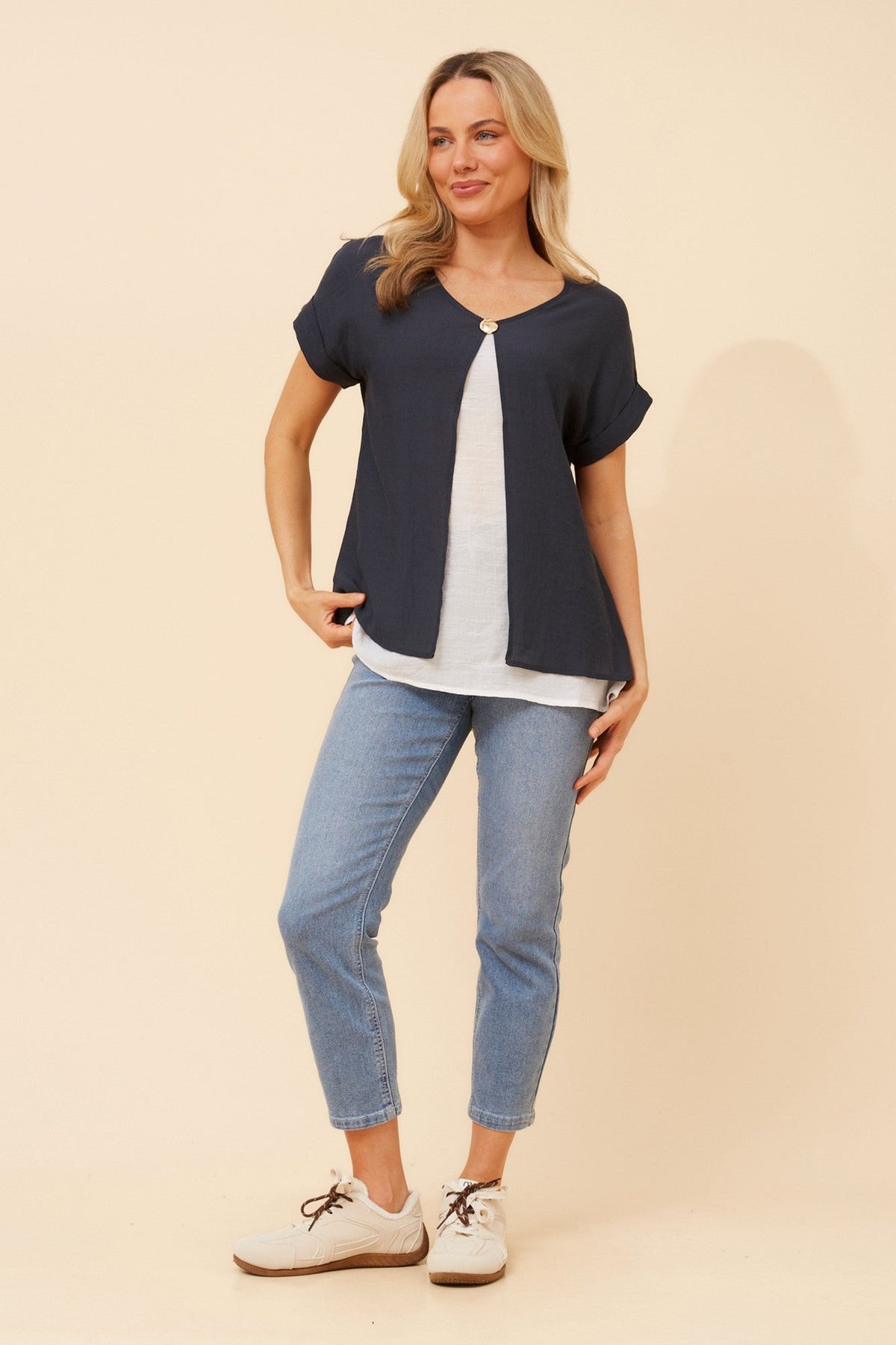 Image of a model wearing Tops. Product name - HENRIET DOUBLE LAYERED TOP in Emerald colour by brand - Caroline Morgan Australia