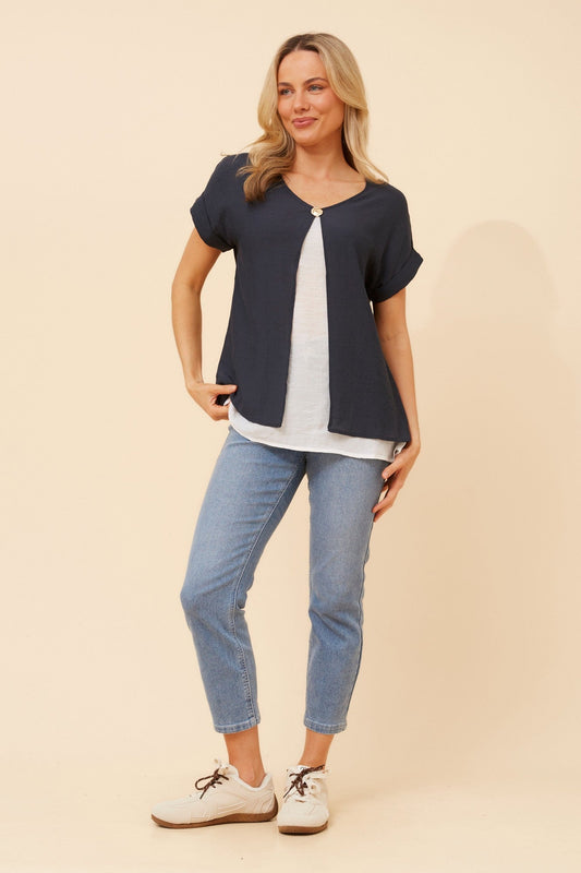 Image of a model wearing Tops. Product name - HENRIET DOUBLE LAYERED TOP in Emerald colour by brand - Caroline Morgan Australia
