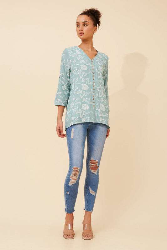 Image of a model wearing Tops. Product name - RUBY FLORAL TOP in Mint colour by brand - Caroline Morgan Australia