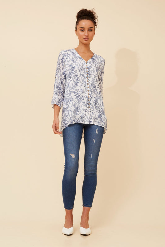Image of a model wearing Tops. Product name - RUBY FLORAL PRINT TOP in Navy colour by brand - Caroline Morgan Australia