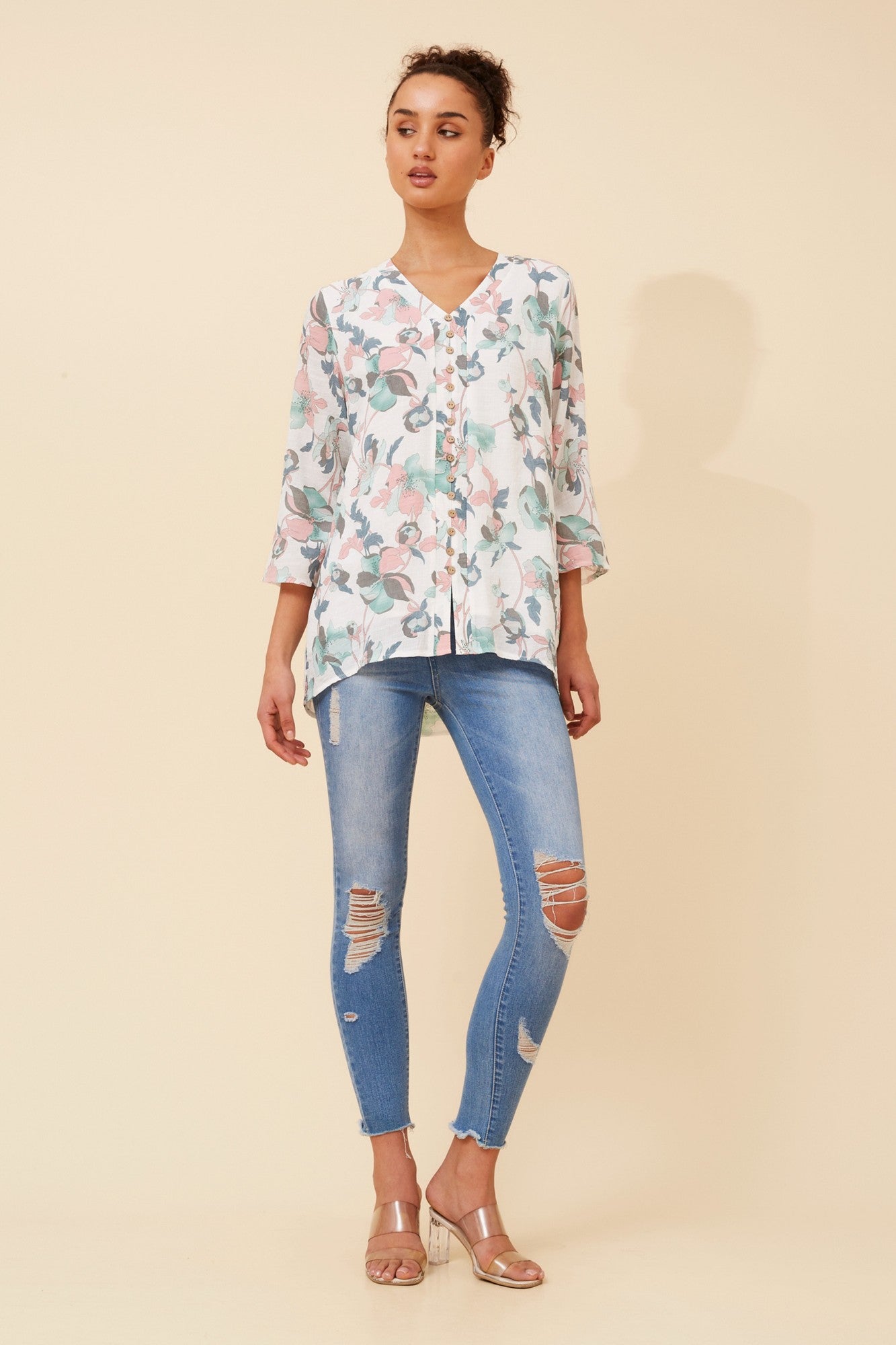 Image of a model wearing Tops. Product name - RUBY FLORAL TOP in Pink colour by brand - Caroline Morgan Australia