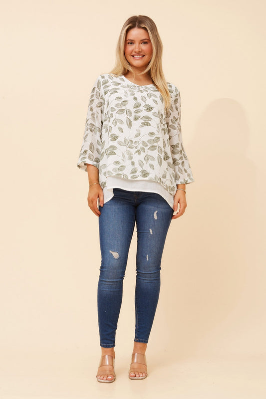 Image of a model wearing Tops. Product name - ERIANA LEAF PRINT TOP in Olive colour by brand - Caroline Morgan Australia