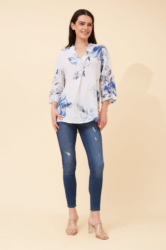 Image of a model wearing Tops. Product name - IVALDA FLORAL LINEN TOP in White colour by brand - BOTTEGA MODA