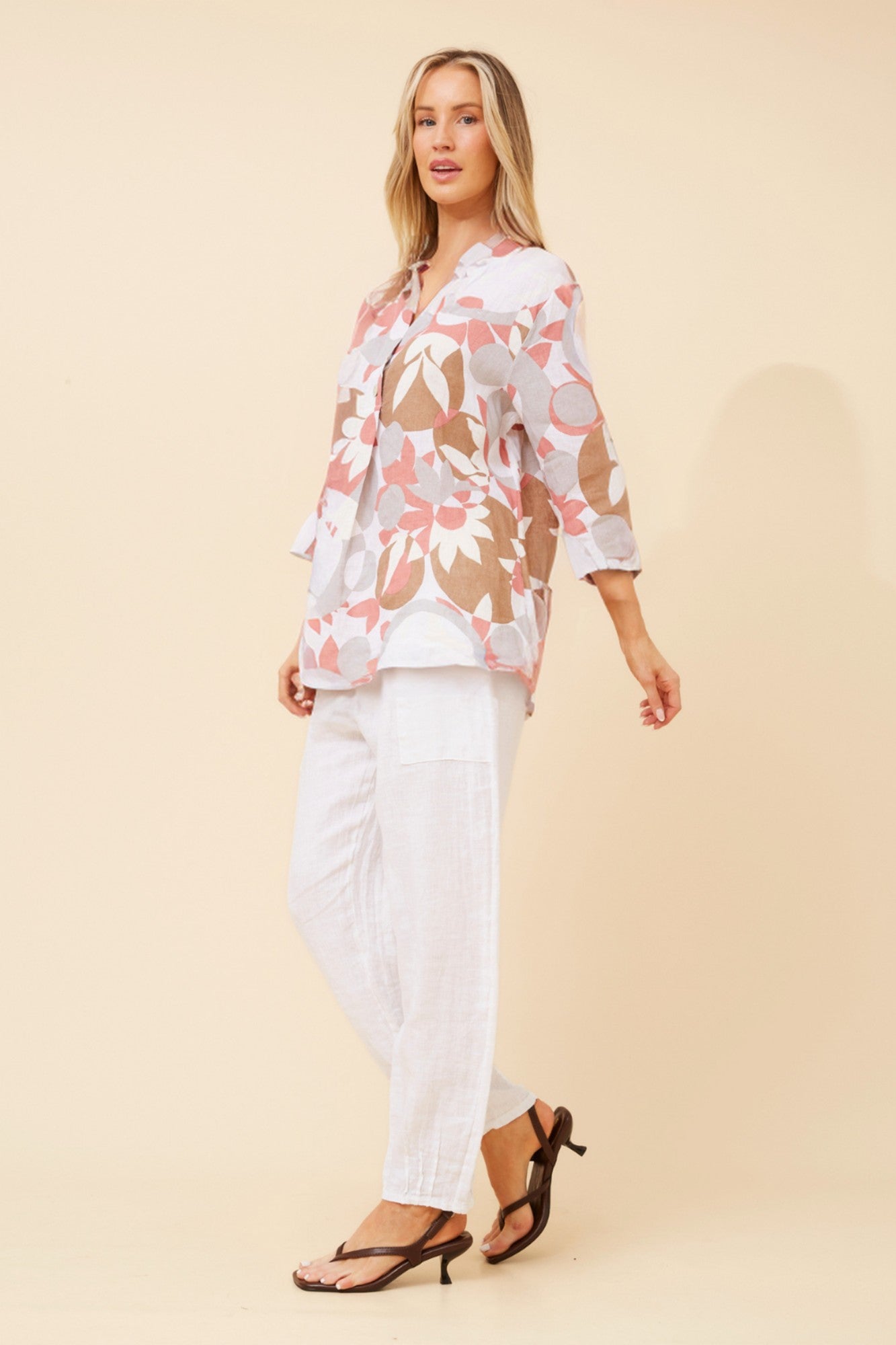 Image of a model wearing Tops. Product name - IVALDA ABSTRACT PRINT LINEN TOP in Multi White colour by brand - BOTTEGA MODA