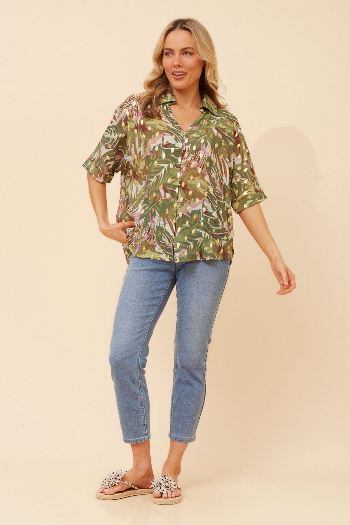 Image of a model wearing Tops. Product name - ZENAIDA FOIL PRINT TOP in Olive colour by brand - Caroline Morgan Australia